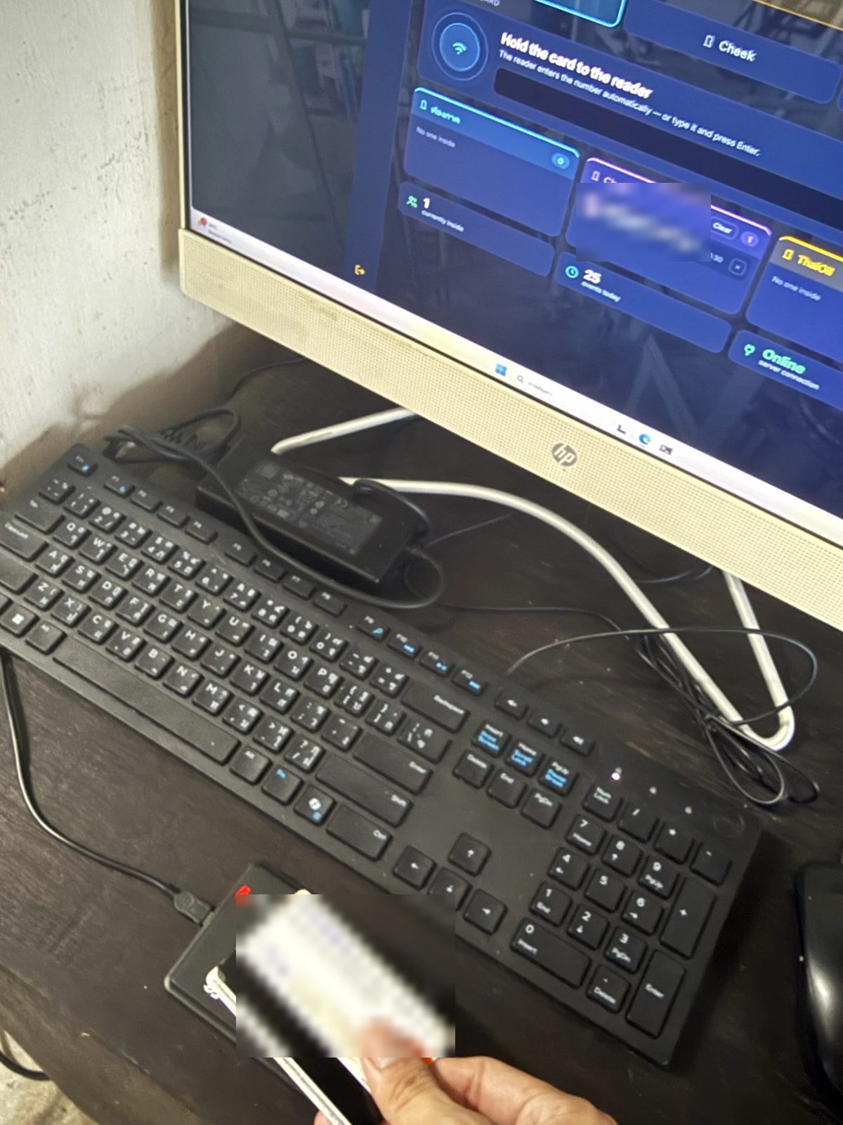 A student card tapped on the USB reader at the guard desk